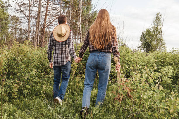 istock Loving couple in the field. Back view. 1299920681