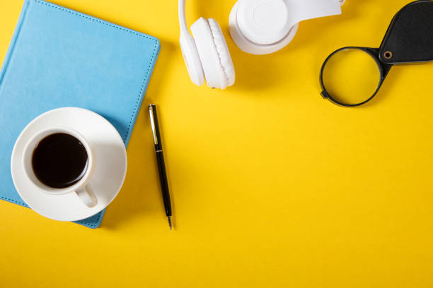 istock coffee on notebook with earphone 1299922180
