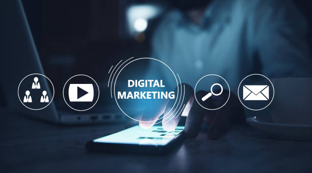 istock man holding phone with Digital Marketing 1299922221