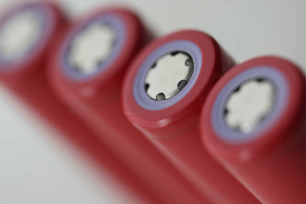 Red rechargeable lithium-ion batteries four pieces closeup