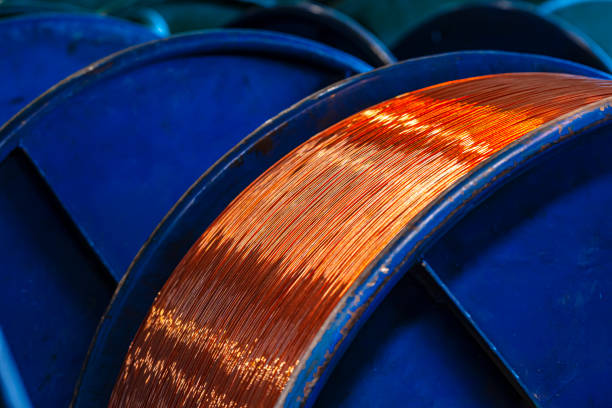 istock Copper wire reels in cable factory close up 1299925634