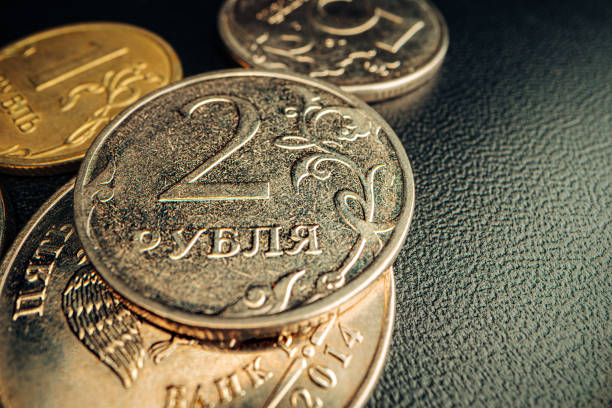 istock Russian rouble coin on dark background close up 1299926313