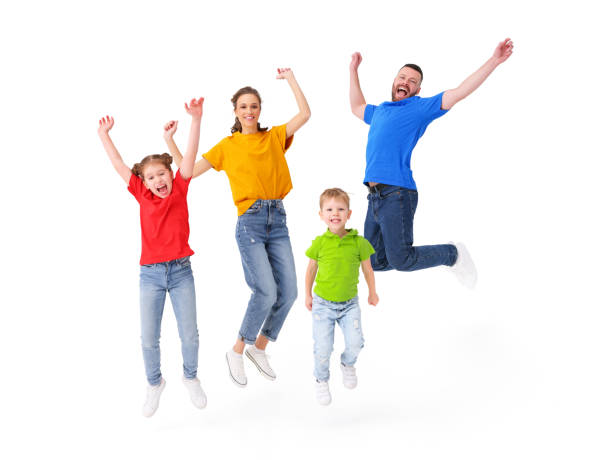 istock Delighted family jumping together in studio 1299926563