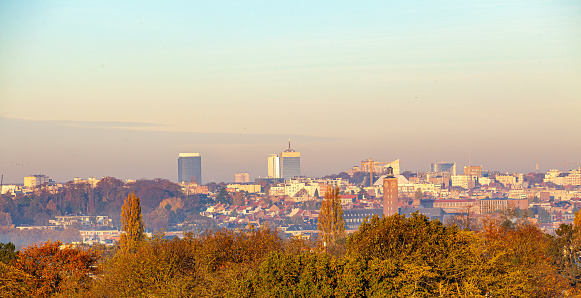 Autumn cityscape of Brussels, the capital city of Belgium at early morning with misty sky, seen from the small Belgian municipality Woluwe-Saint-Pierre in the east side of Brussels