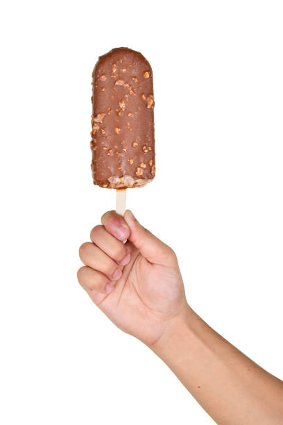 Chocolate ice cream in hand isolated on white background with clipping path