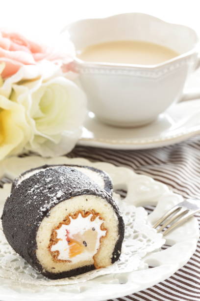 istock Mango and black color swiss roll on dish 1299931787