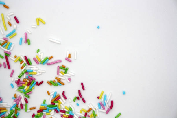 istock Colorful confectionery sprinkles on a white background. 1299932177