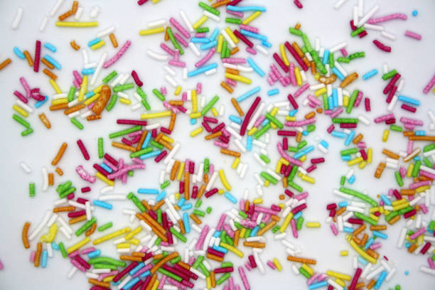 istock Colorful confectionery sprinkles on a white background. 1299932201
