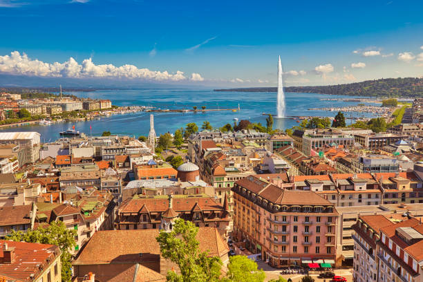 Geneva aerial view Switzerland Geneva skyline cityscape, French-Swiss in Switzerland. Aerial view of Jet d'eau fountain, Lake Leman, bay and harbor from the bell tower of Saint-Pierre Cathedral. Sunny day blue sky. bell tower tower photos stock pictures, royalty-free photos & images