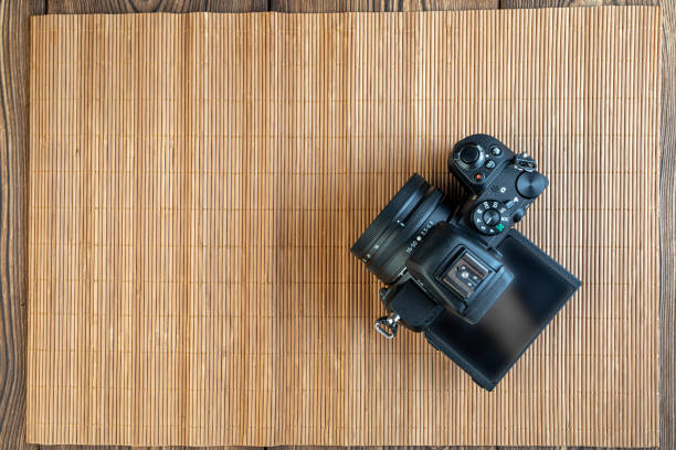 istock camera on wooden background 1299936925