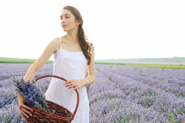 istock Young girl in lavender field 1299939793