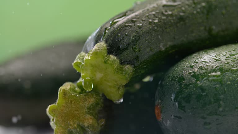 SLO MO LD Waterdrop falling off a zucchini