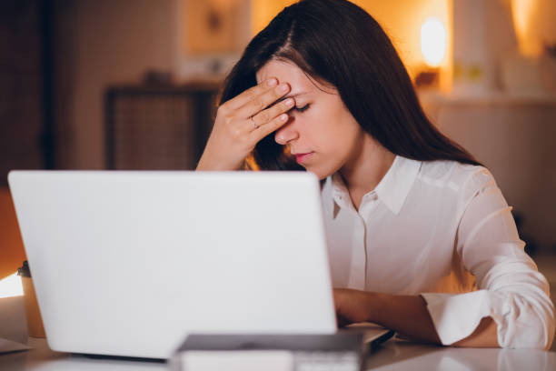 istock Businesswoman having a headache 1299940098
