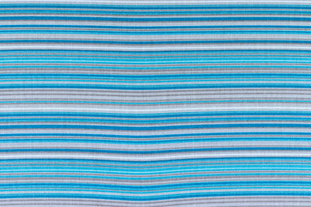 istock Striped fabric textile background in blue, white and gray colors 1299940618