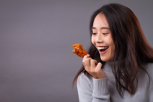 happy woman with fried chicken