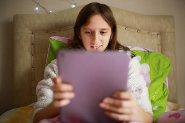istock girl looking at the tablet 1299941661