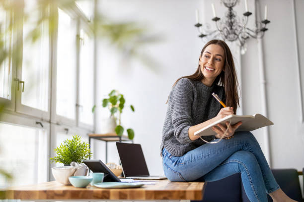 istock Young woman working in creative start-up company 1299941735