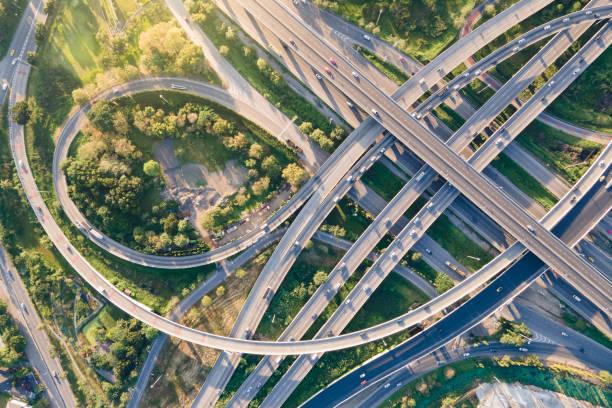 istock Aerial view of road interchange or highway intersection 1299942258