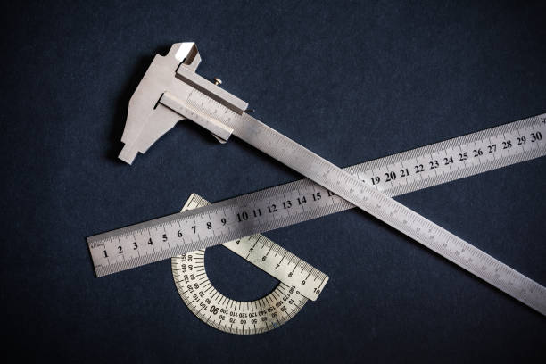 istock Goniometer and Ruler and Vernier caliper three types on dark grey-black patterns background. Non-color, monochrome black and white photo. 1299943570