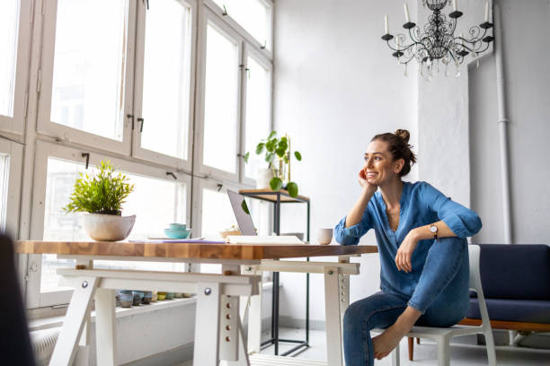 istock Portrait of a smiling creative woman in a modern loft space 1299943688