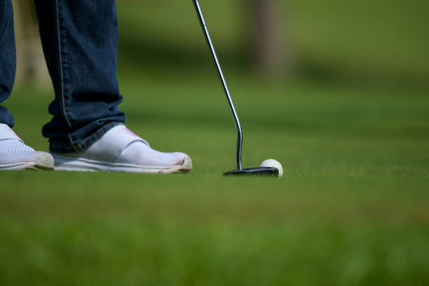 istock Golf club and ball in grass 1299944167