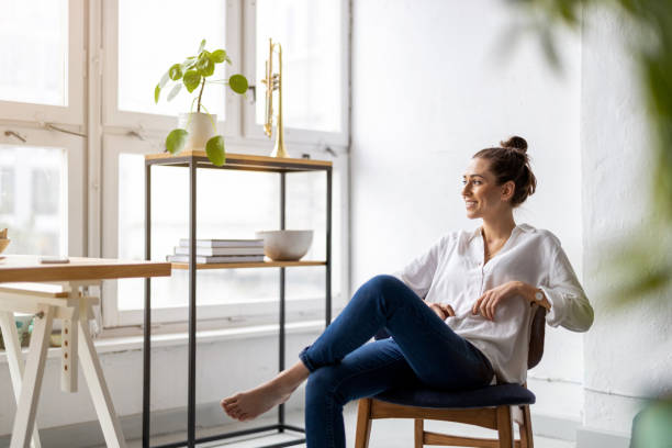 Portrait of a smiling creative woman in a modern loft space