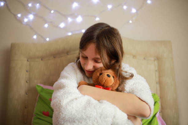 istock girl who loves her teddy bear 1299946735
