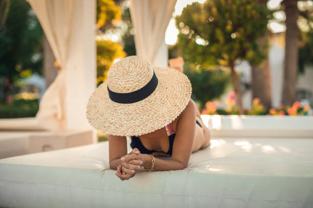 Woman relaxing at paradise. Luxury hotel resort