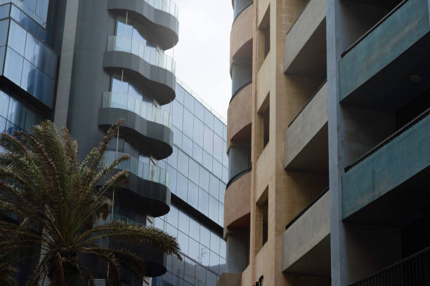 istock Concrete Facade With Balconies Contrasting With A Glass Facade Building 1299955438