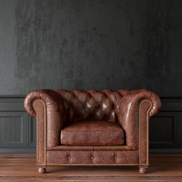 poltrona vintage contro muro nero - armchair sofa leather brown foto e immagini stock
