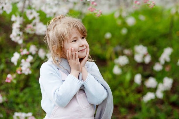 istock Young Girl Playing Outdoors in Springtime 1299955526