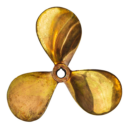 Vintage three bladed brass ship screw propeller isolated on a white background