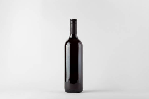 istock Black wine bottle with red wine isolated on white 1299959349