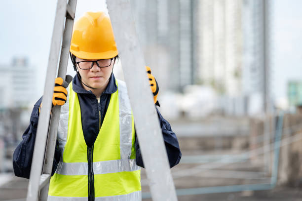 istock Maintenance worker man carrying aluminium ladder 1299960794