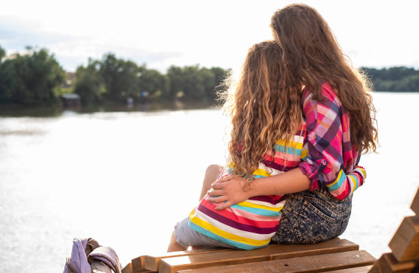 istock Girls enjoying sunset 1299961481