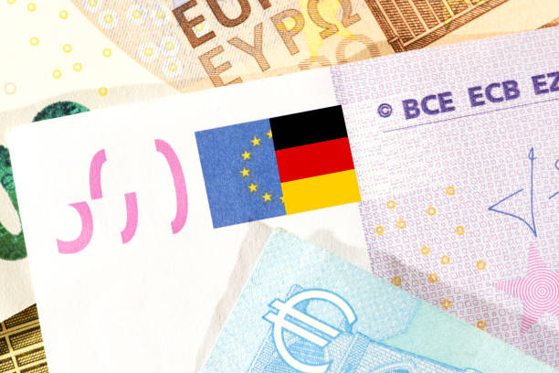 istock Euro banknotes and flag of Germany 1299961904