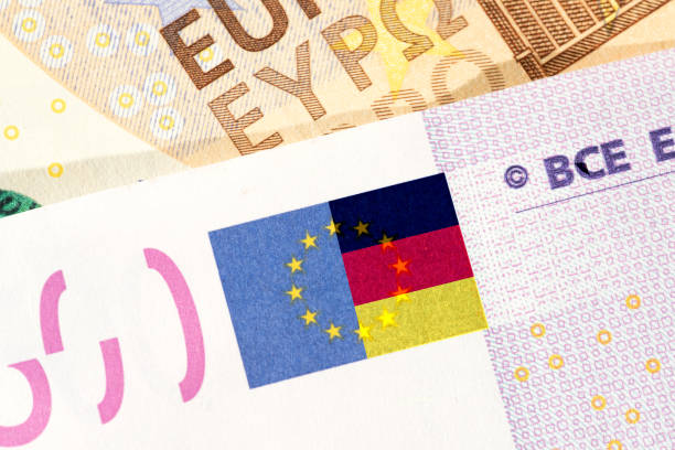 istock Euro banknotes and flag of Germany 1299961916