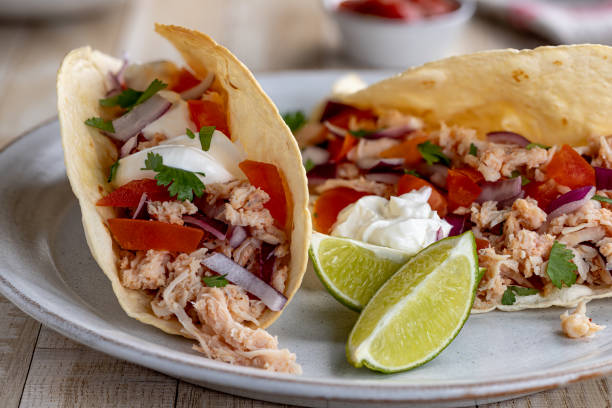 istock Chicken Tacos With Tomato, Onion and Sour Cream 1299962181