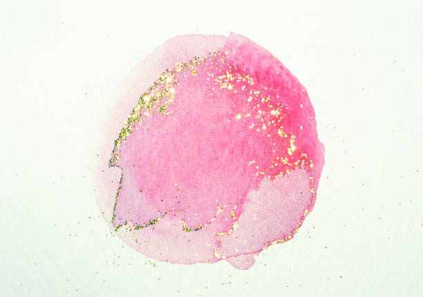 istock Abstract pink watercolor splash and golden glitter 1299962270