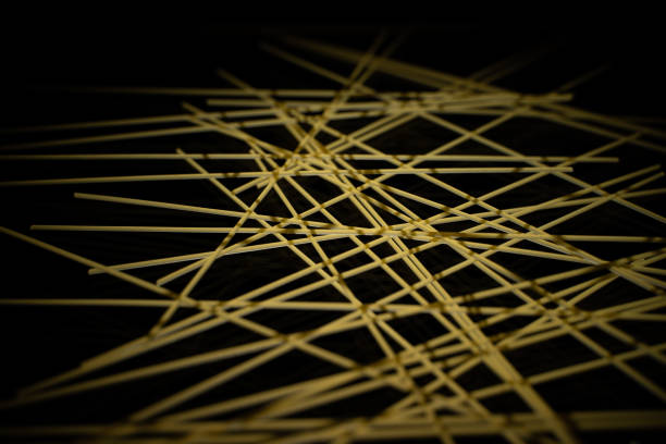 raw spaghetti on black background, Italian pasta