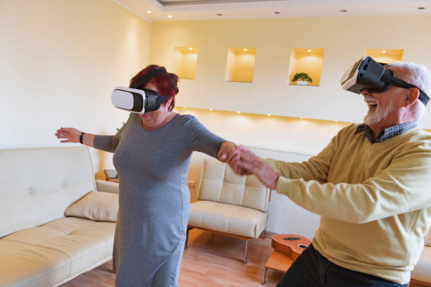 istock Excited Senior Couple is Using VR Goggles and Gesturing with Their Hands. 1299963456