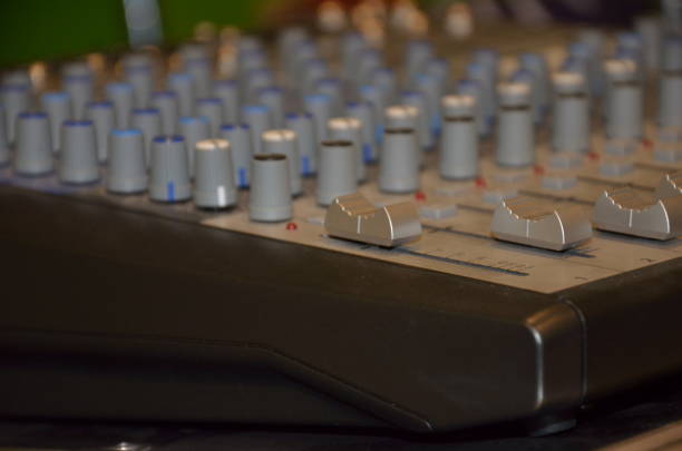 istock Professional audio mixing console with faders and adjusting knobs,TV equipment selective focus 1299963602