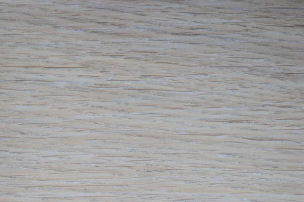 istock Closeup of brown wood laminate flooring pattern 1299963632