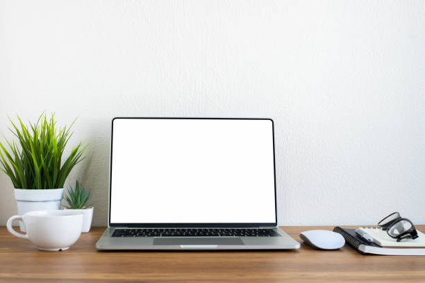 istock Wooden office desk table with keyboard of laptop, coffee cup and notebook, mouse computer with equipment office supplies. Business and finance concept. Workplace, Flat lay with blank copy space. 1299964288