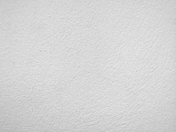 istock White color​ paint​ on Cement​ wall​ concrete textured background​ abstract​ grey​ color​ material​ smooth surface 1299965670