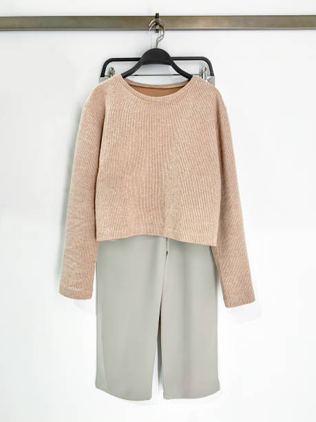 istock Women's trousers and sweater 1299965769