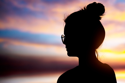 Silhouette of young woman