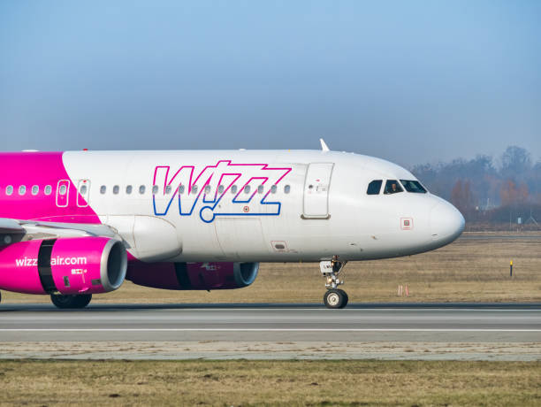 a wizz air airbus a320-232 (ha-lwn) airplane on the airport runway at henri coanda international airport. - wheel airplane landing air vehicle imagens e fotografias de stock