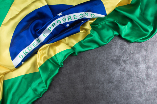 Brazilian flag on gray background and copy space.
