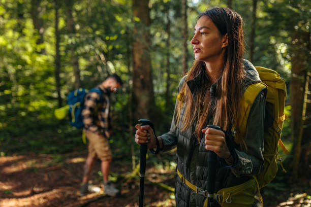 istock Young couple hiking through the wood 1299969314